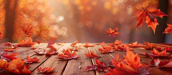 Poster - Maple autumn leaves on a wooden surface. with copy space image. Place for adding text or design