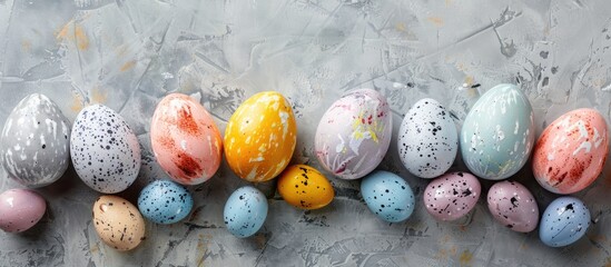 Colorfully decorated Easter eggs on a grey background Top view Copy space