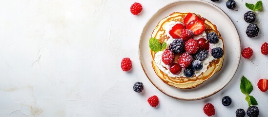 Fototapete - Homemade cottage cheese pancakes topped with fresh berries on a white table Copy space
