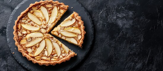 Aufkleber - Slice of pear almond cream tart Dark background top view copy space