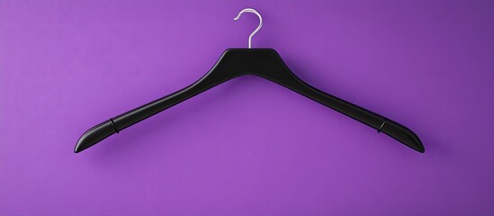 Black Friday sales idea Empty hanger against a purple backdrop. with copy space image. Place for adding text or design