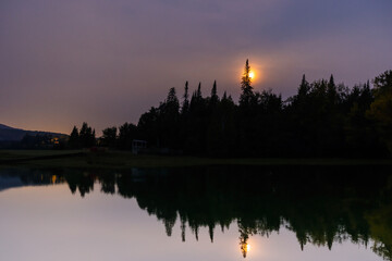Wall Mural - full moon over the lake in mont tremblant national park, canada