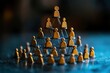 © Worrapol - The Golden Hierarchy: A miniature golden pyramid of people represents the complexities of corporate structure and leadership.