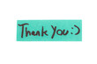 © wollertz - A piece of paper with the words 'thank you' written in black. The paper is placed on a white background
