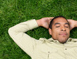 © Designpics - Man Lying on Grass