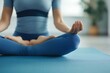 © Naruemon - Woman meditating on a yoga mat, serene indoor space, focus on mental fitness and goal-setting