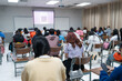 © EduLife Photos - Selective focused high school or university students are intently writing on their answer sheets during a final exam in the classroom.
