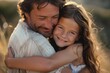 © chutikan - Close-up of a loving father embracing his joyful daughter, both smiling warmly, epitomizing familial love and happiness