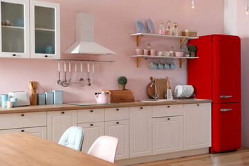 Wall Mural - Red refrigerator in kitchen. Bright color accent in interior