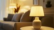 © PixelPlace - Close-up of a cozy living room with a warm-lit table lamp, soft sofa, and inviting atmosphere perfect for relaxation.
