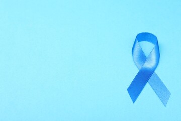 Canvas Print - Blue ribbon on color background, top view with space for text. Prostate cancer awareness