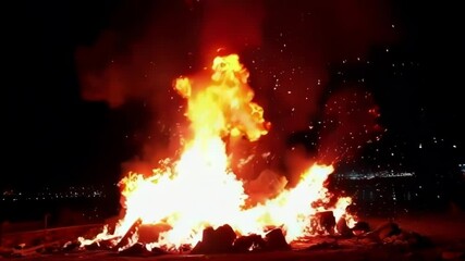 Wall Mural - a dramatic explosion at night, illuminating the scene with fire and sparks, capturing chaos and inte