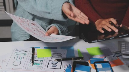 The designer team is designing the uxui system to make the uxui system work well on new phones and support system updates. Website development concept UI UX front end designer