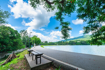 Wall Mural - a public place leisure travel landscape lake views at Ang Kaew Chiang Mai University and Doi Suthep nature forest Mountain views spring cloudy sky background with white cloud.