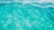 © venusvi - Crystal clear turquoise ocean water texture with gentle ripples