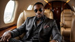 © Gaston - Portrait of an African American rapper sitting in the luxurious cabin of his private jet, dressed in stylish suit, gold chains and sunglasses. Black businessman in a private plane