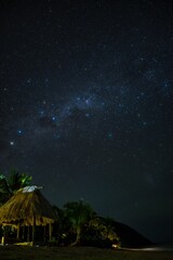 Wall Mural - fiji nighttime beach scene on a small island. stunning night sky and milky way over the yasawa islan