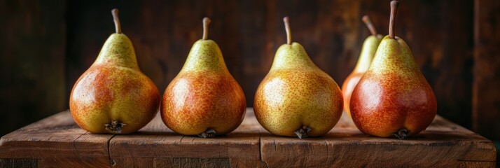 Wall Mural - Fresh pear fruit on table with dark background