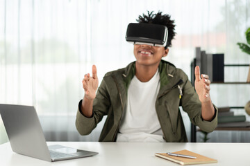 Surprised young African American looking through VR holding interesting data object hologram metaverse world connecting digital futuristic technology virtual reality meta modern office. Contrivance.