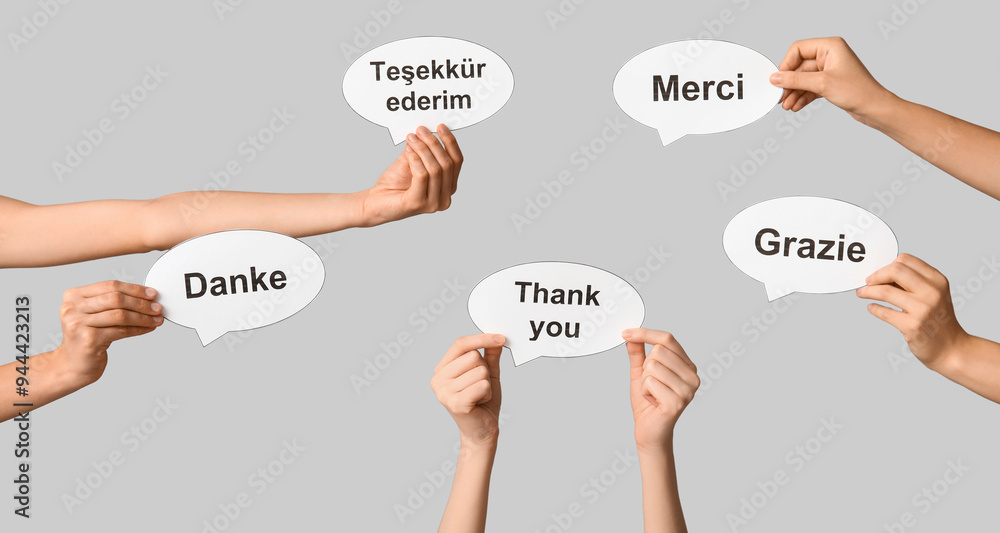 Hands holding speech bubbles with text THANK YOU in different languages ...