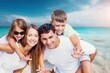 © BillionPhotos.com - Happy young family and children on the beach on vacation
