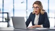 © Сергій Колесніков - Surprised manager or freelancer, wow, success, career. Young businesswoman with shocked excited expression looking at laptop.
