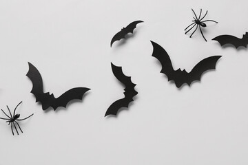 Wall Mural - Paper bats and spiders for Halloween party on grey background