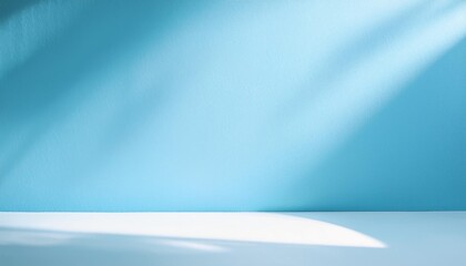 Wall Mural - minimalistic abstract gentle light blue background for product presentation with sunny light and intricate shadow on wall