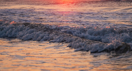 Avalon, New Jersey, USA - Ocean waves at sunrise off the beach in Avalon New Jersey on the southern New Jersey shore south of Atlantic City
