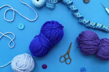 Sticker - Yarn balls, measuring tape and scissors on blue background