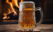 © Miklos - A frosty mug of beer sits on a wooden table in front of a roaring fireplace