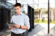 © BillionPhotos.com - Focused successful businessman with digital tablet