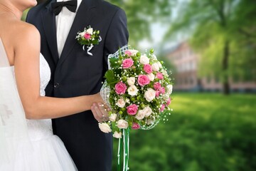 Canvas Print - Happy young wedding couple bride and groomoutdoor