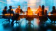© Thanthara - Blurred lines of leadership focused teamwork in a dynamic boardroom