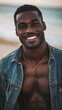 © Graphic Resources - Smiling handsome black man on the beach