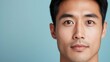 © Jayda_ArtistryHub - Close-up of an Asian man with even, blemish-free skin, natural light enhancing his healthy, clear complexion, blemish-free skin, healthy complexion, natural beauty