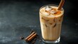 © Heng Heng - AI Stock - Iced Chai Tea Latte with Cinnamon Stick Served in Glass   Comforting and Aromatic Autumn or Winter Beverage with Copy Space for Text