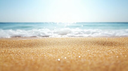 Wall Mural - A beach with a clear blue sky and a small wave