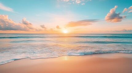 Wall Mural - Sunset over calm ocean waves at a serene beach during early evening with soft clouds in the sky