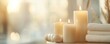 © ThamDesign - Serene arrangement of lit candles and soft towels, creating a calming and peaceful atmosphere for relaxation and self-care.