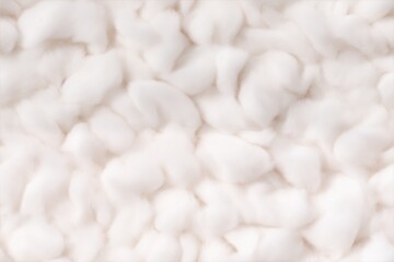 Soft, fluffy batting cotton fibers in a white background, creating a textured appearance.