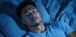 © Balaraw - Man sleeping peacefully in blue-toned bedroom