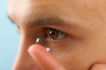 Sticker - Installation of a contact lens in the eye close-up