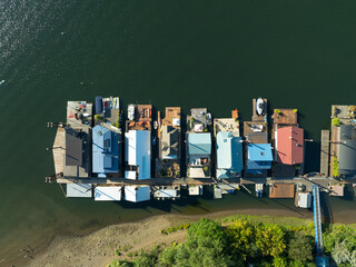 A group of colorful boats are docked in a marina