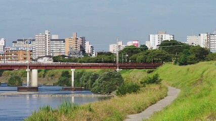 Wall Mural - 大和川に架かる鉄橋を渡る近鉄特急「青の交響曲」