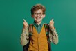 © sergiokat - Portrait of smiling schoolboy with school bag and shows the sign approx, dressed in school uniform, isolated on only green background