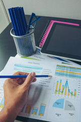 Wall Mural - Vertical Businesswoman reading financial graph charts business info with computer laptop. Vertical horizon Women hands using laptop on office desk. Close up hands of business woman working office