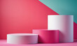 © Miklos - Three cylindrical platforms sit on a pink and teal background