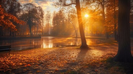 The peaceful park glows in warm morning light, with colorful autumn foliage and calm water reflecting tree leaves. Misty fog adds to the serene beauty of the landscape