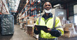 © peopleimages.com - Black man, smile and tablet in warehouse for inspection, inventory check and stock management for web. Logistic, thinking or mature supervisor with tech for shipping order, quality control or courier